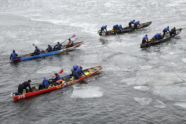 Canoe race challenge over the partly frozen Saint Lawrence River