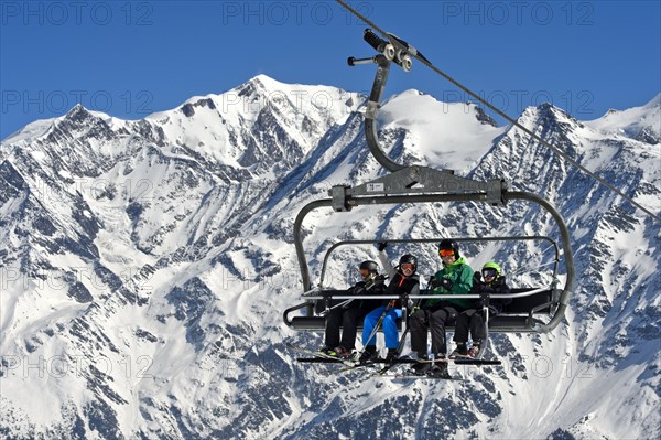 Skiers on chair lift, Les Contamines-Montjoie ski resort