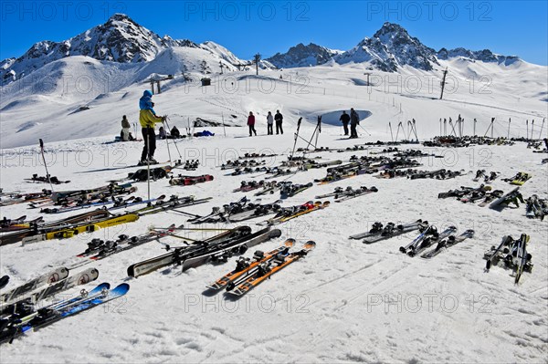 Pairs of skis lying on snow, Les Contamines-Montjoie ski resort
