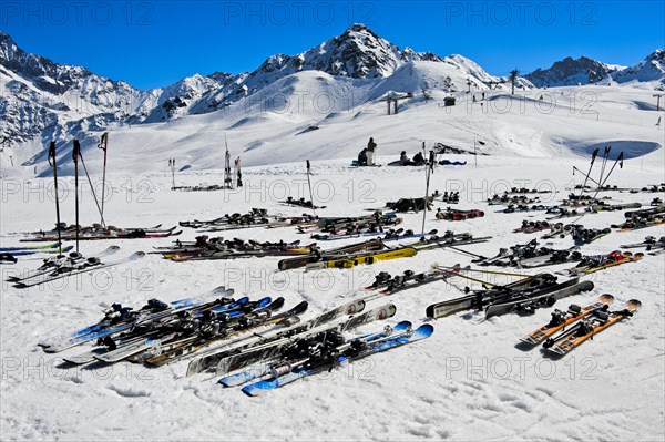 Pairs of skis lying on snow, Les Contamines-Montjoie ski resort