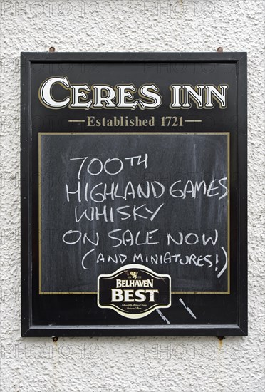 Restaurant sign displaying 700th Highland Games Whiskey