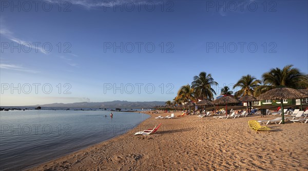 Tropical beach with palm trees at the Hotel Club Amigo Costa Sur