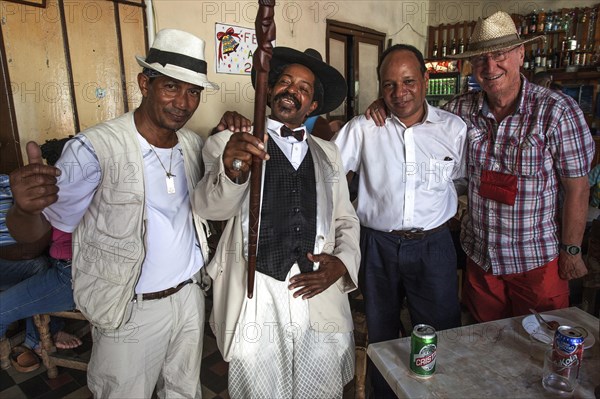 Men meeting in a Casa de la Trova