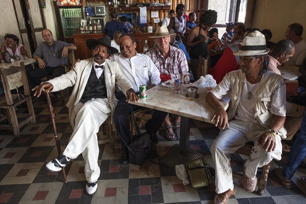 Men meeting in a Casa de la Trova