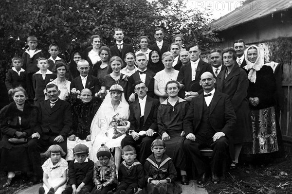 Wedding couple with guests