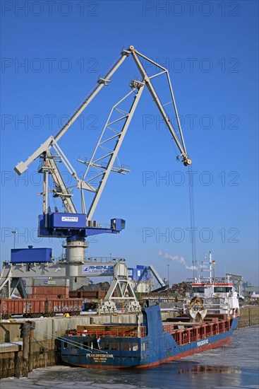 Cargo ship loading sand