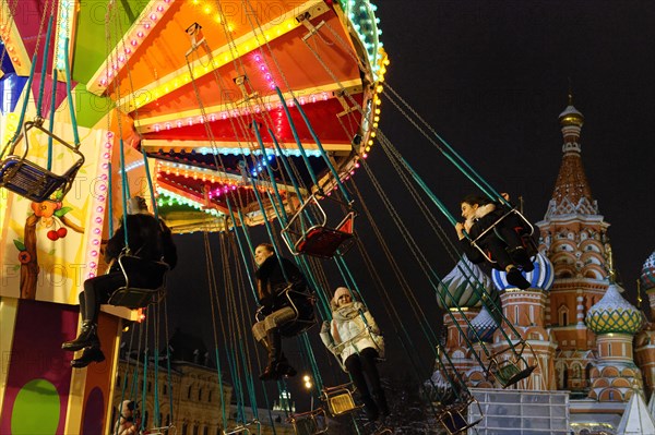 Chain carousel at the Christmas market next to the GUM ice rink