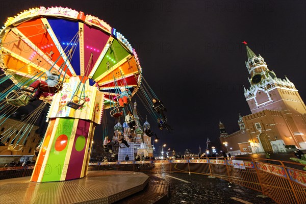 Chain carousel at the Christmas market next to the GUM ice rink