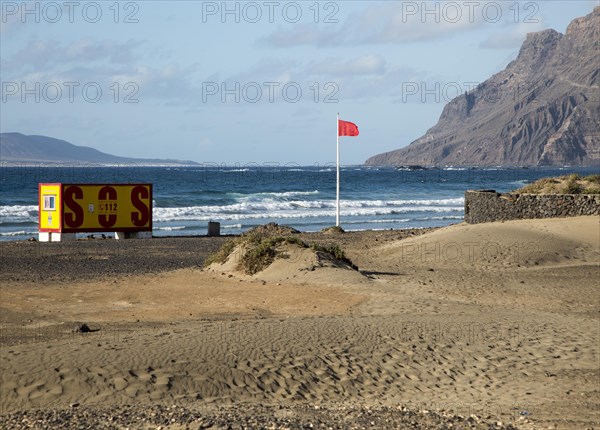 Red flag flying warning of bathing danger