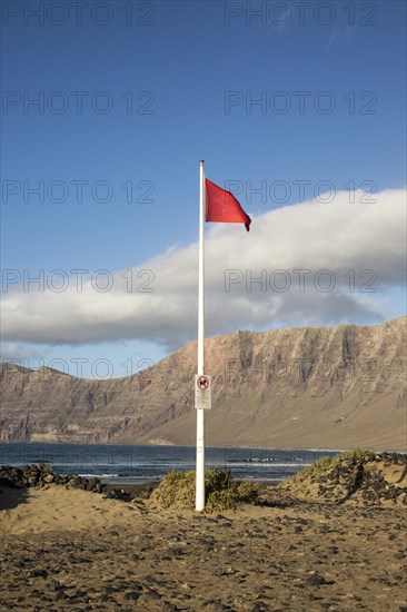 Red flag flying warning of bathing danger