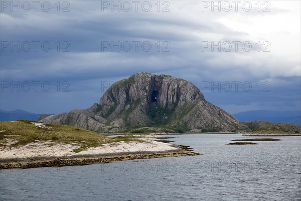 Torghatten granite mountain with a hole through it