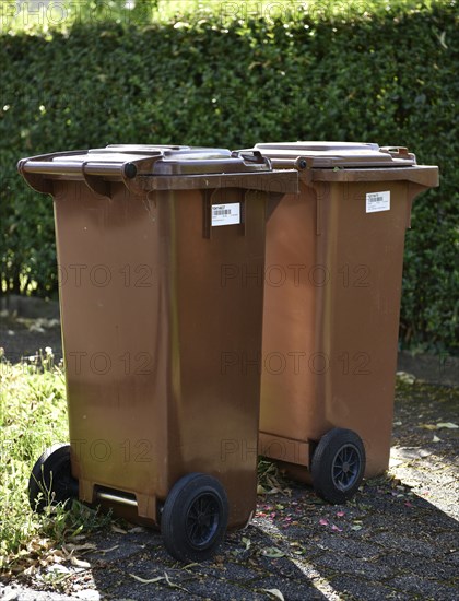 Brown garbage bins for organic waste with barcode labels