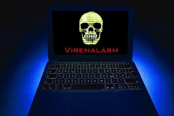 Laptop with skull and crossbones on screen