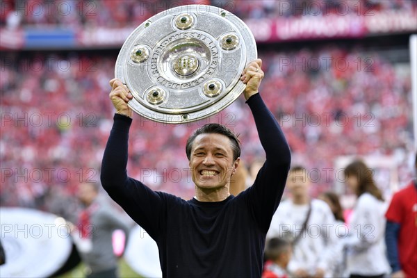 Coach Coach Niko Kovac FC Bayern Munich FCB cheers with championship cup