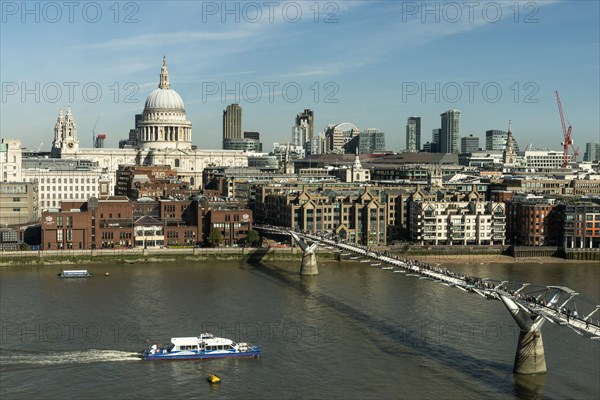 London skyline with St Paul's Cathedral and Millennium Bridge over the River Thames