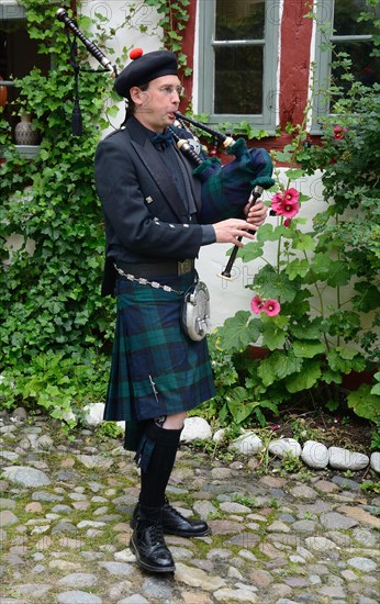 Swedish musician plays bagpipe