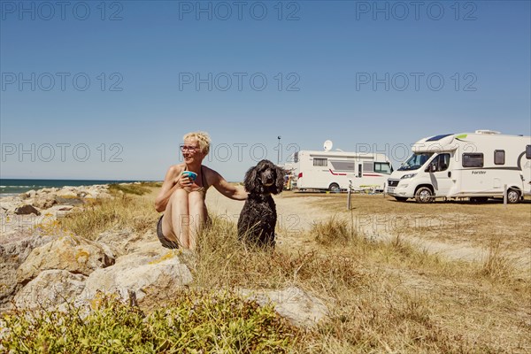 Woman with sits with her dog