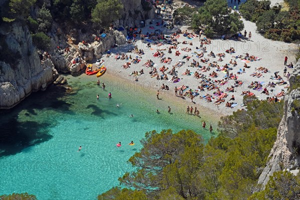 Tourists at beach with turquoise water