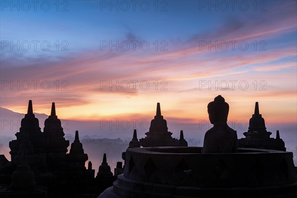 Buddha statue at sunrise