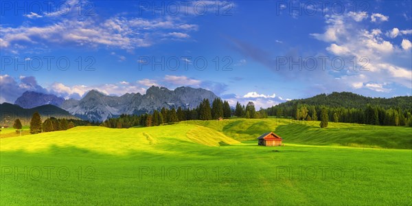 green meadows with cottage