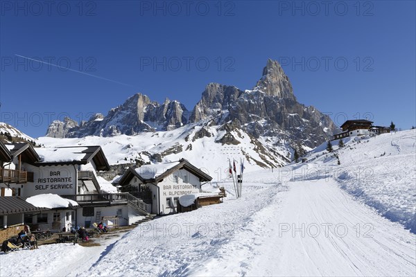 Restaurant at the mountain pass Passo Rolle with snow