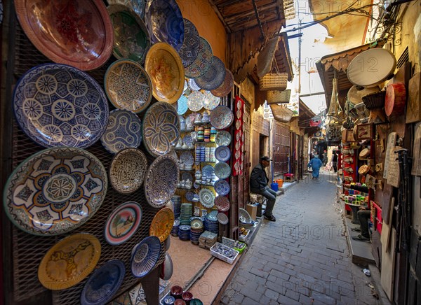 Colourfully painted plates and tiles