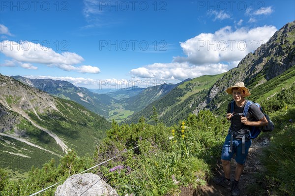 Hiker on the hiking trail from Hinterstein to Schrecksee