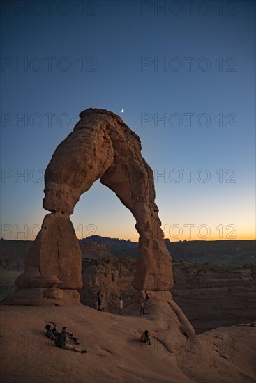 Delicate Arch rock arch Evening sky with moon