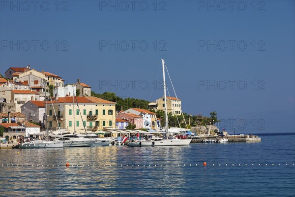 Small fishing village with sailing boats