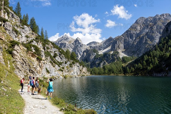 Hikers at the mountain lake