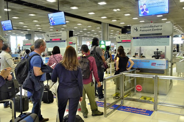 Tourists waiting at the counter to passport control