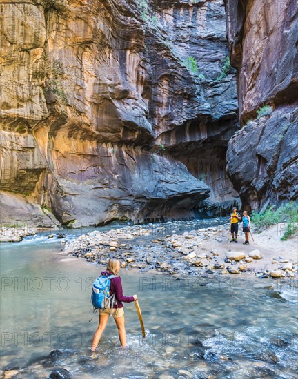 Hiker crossing river