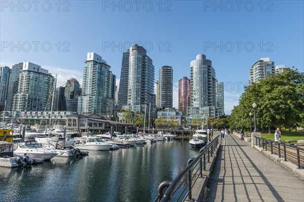 High-rise buildings on the promenade with marina