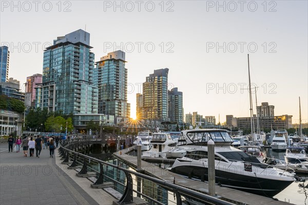 High-rise buildings on the promenade with marina