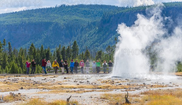 Tourists watching the eruption of Jewel Geyser