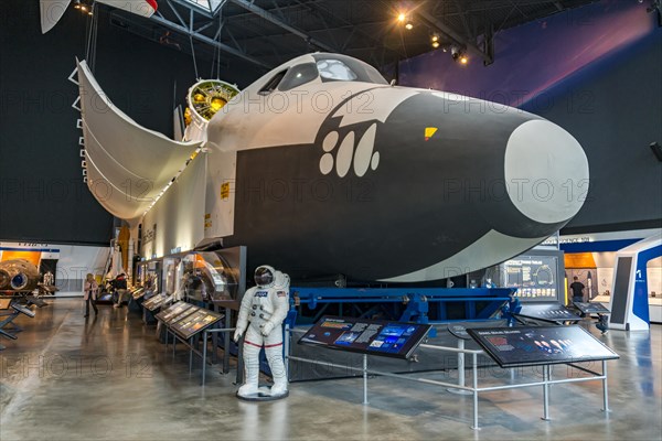 Space Shuttle and an astronaut in a space suit