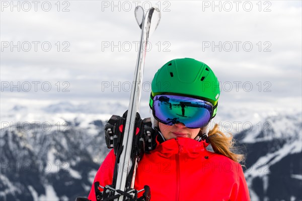 Female skier with ski helmet
