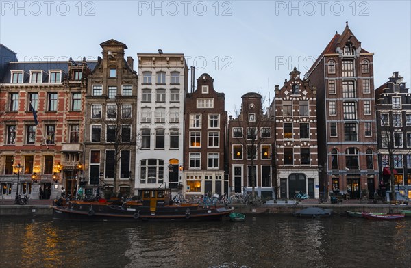 Historic row of houses on a canal at dusk