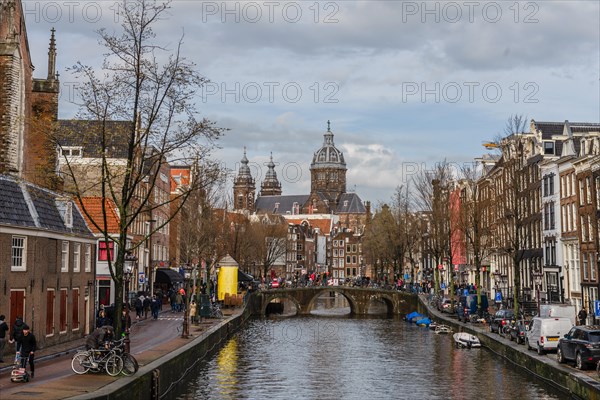 View from a bridge at Oudezijds Voorburgwal to the canal and the Sint Nicolaaskerk