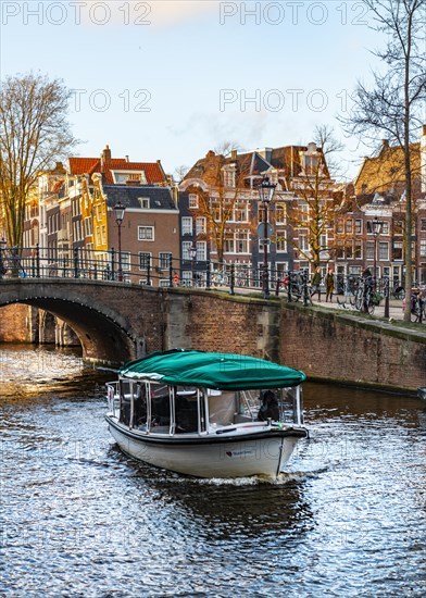 Boat on canal with bridge