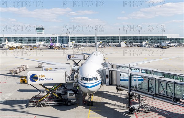 Passenger aircraft with docked passenger boarding bridge