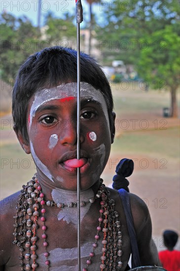 Young Yogi with a pierced tongue