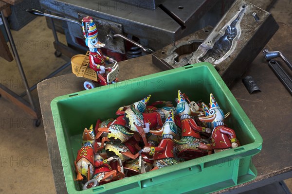 assembly box with tin toys of the 1950s