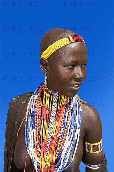 Woman with many pearl necklaces as necklace