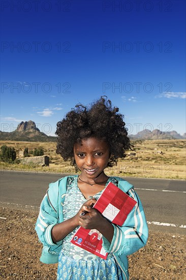 Little girl with exercise book