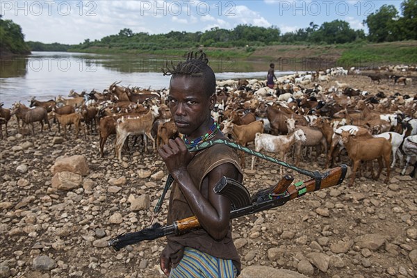 Goatherd of the Hamer tribe with Kalashnikov