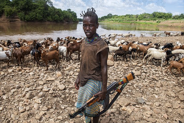 Goatherd of the Hamer tribe with Kalashnikov