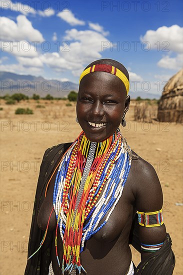 Laughing young woman with necklace