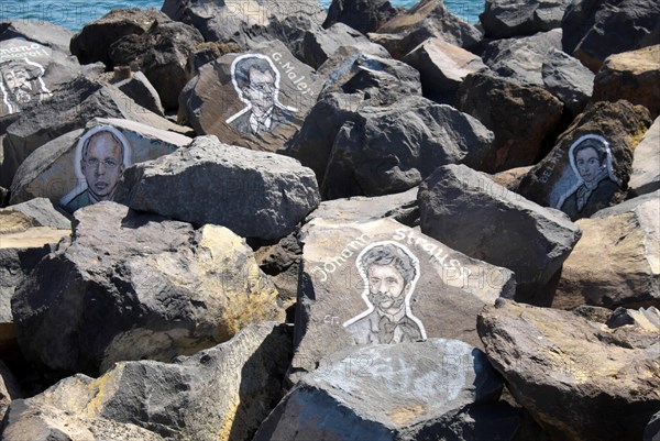 Painted portraits of famous musicians and composers on stone blocks