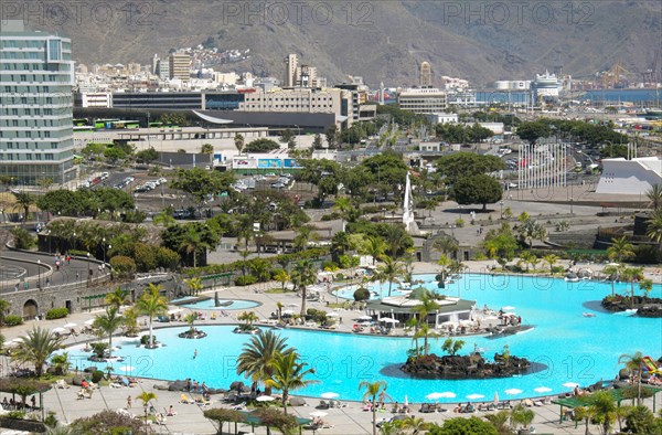 Overview of Parque Maritimo outdoor swimming pool of Cesar Manrique and city